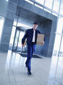 Courier with clipboard and cardboard box